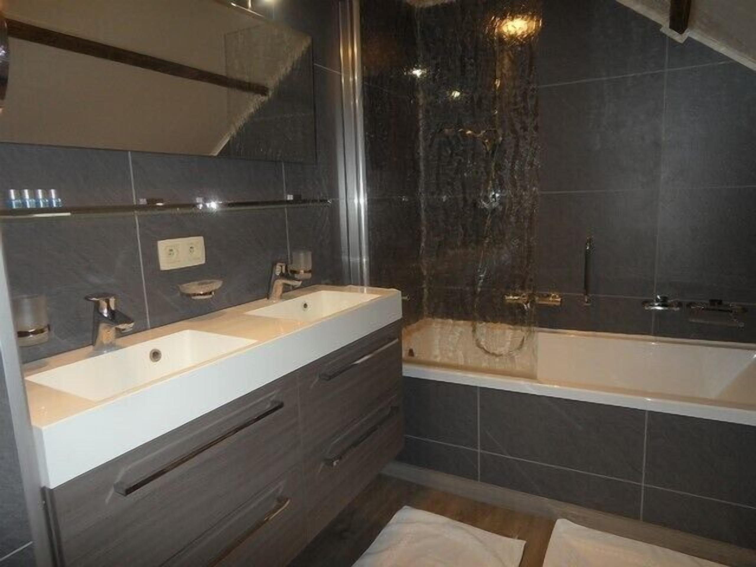 comfort quadruple room | bathroom | free toiletries, hair dryer, towels