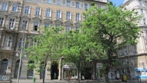 A multi-story building with a classical architectural style, featuring arched windows and a symmetrical facade. - Friends Hostel and Apartments Budapest (Budapest)
