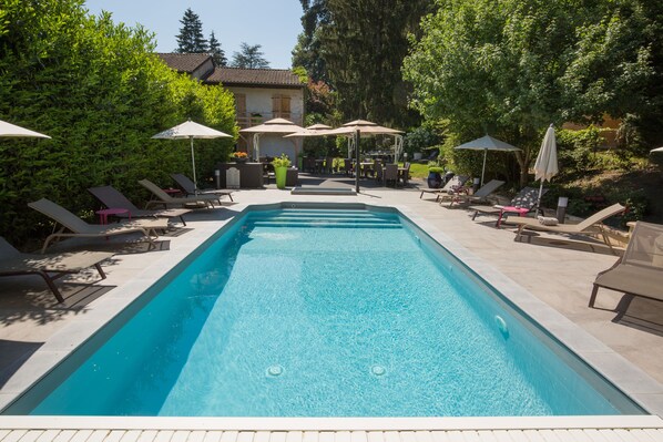 Seasonal outdoor pool, open 9 AM to 8:30 PM, pool loungers