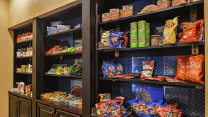 A snack display with various chips and snacks. - Hampton Inn Jackson (Jackson)