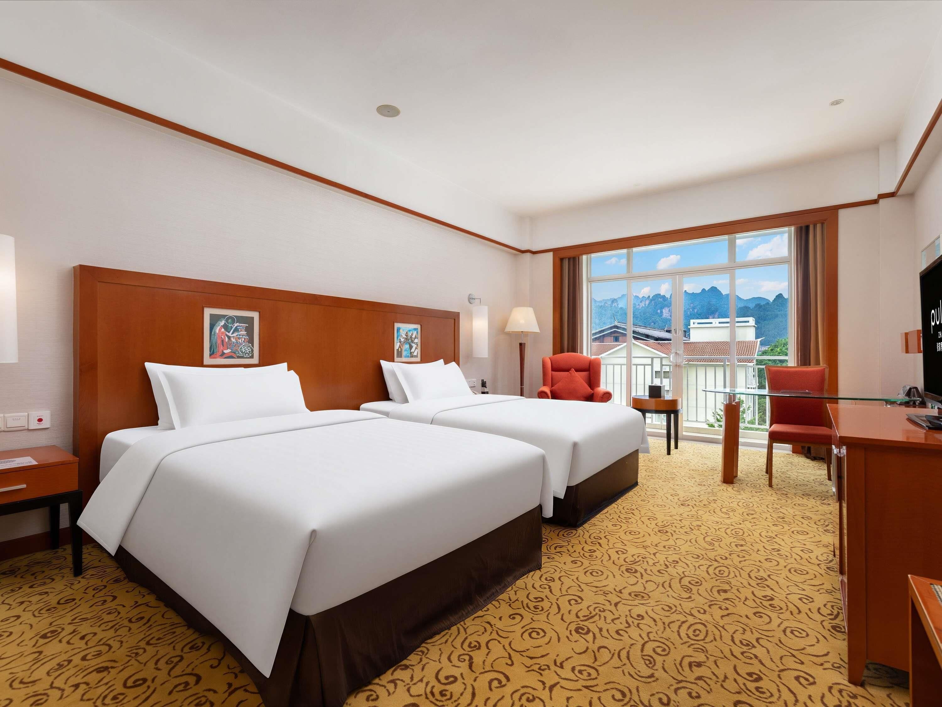 Deluxe kamer, 2 eenpersoonsbedden | Luxe beddengoed, een kluis op de kamer, een bureau, geluiddichte muren