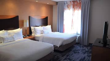 Premium bedding, pillow-top beds, desk, laptop workspace