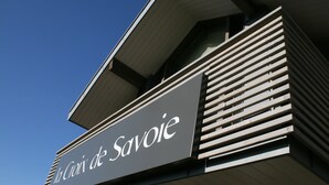 A building with a sign reading "la Croix de Savoie".