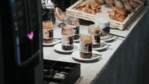 A breakfast buffet with pastries, jams, and a coffee machine. - Citotel Dav'hotel Jaude (Clermont-Ferrand)