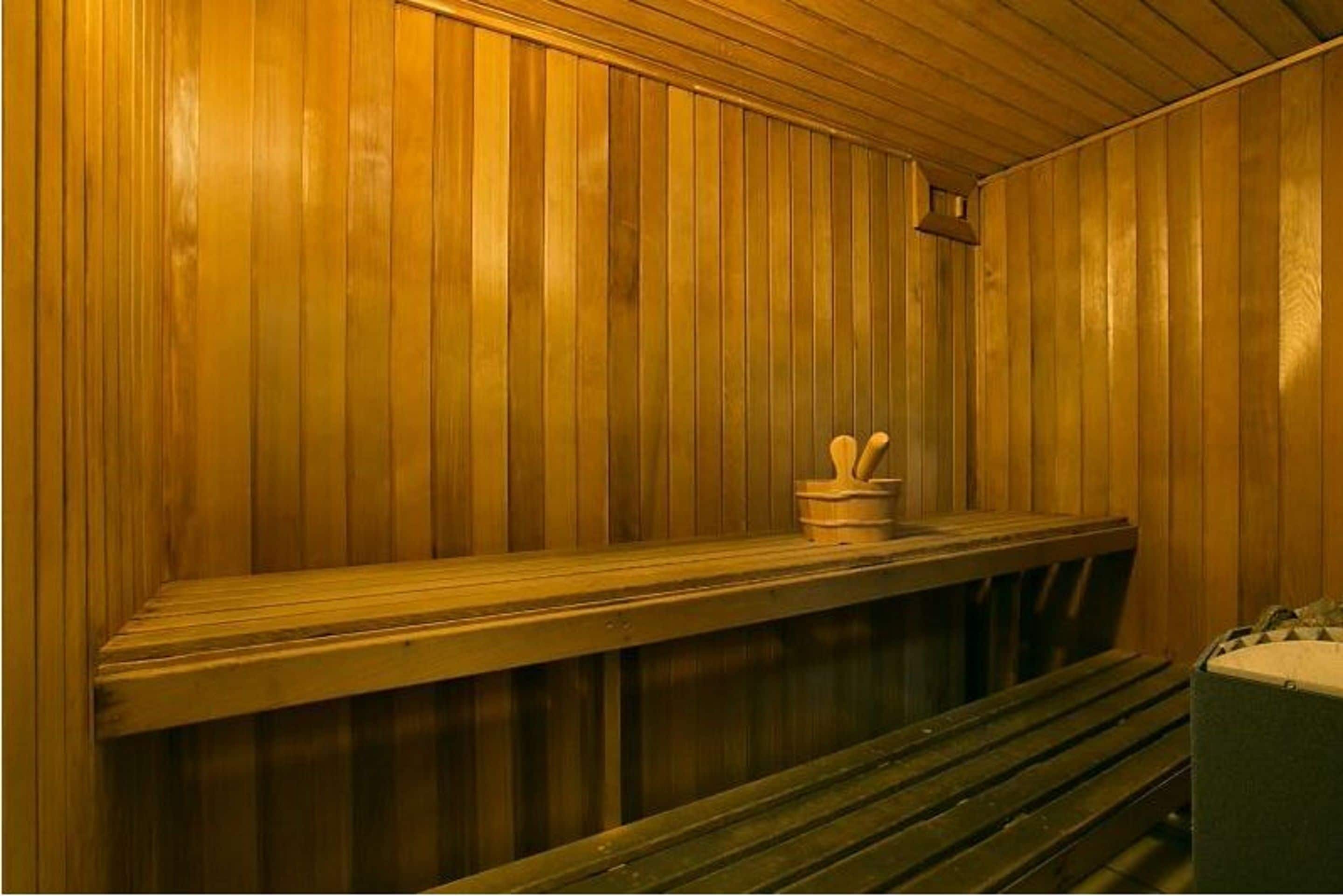 A sauna with wooden walls and benches.