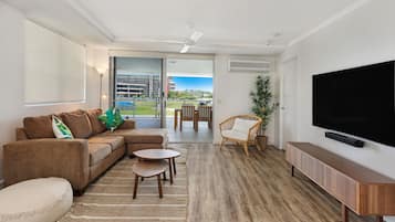 Deluxe Apartment, 2 Bedrooms | Living area | 42-inch flat-screen TV with cable channels, TV