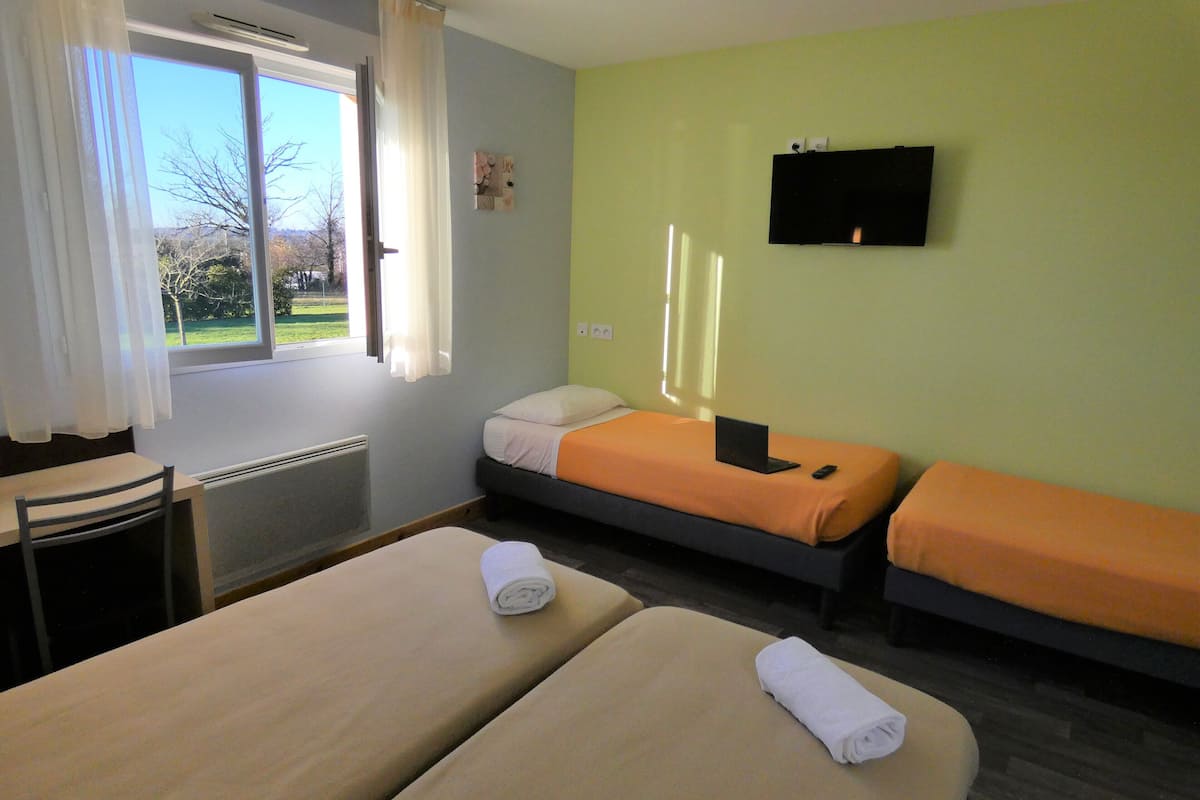 classic quadruple room | premium bedding, individually furnished, desk, laptop workspace