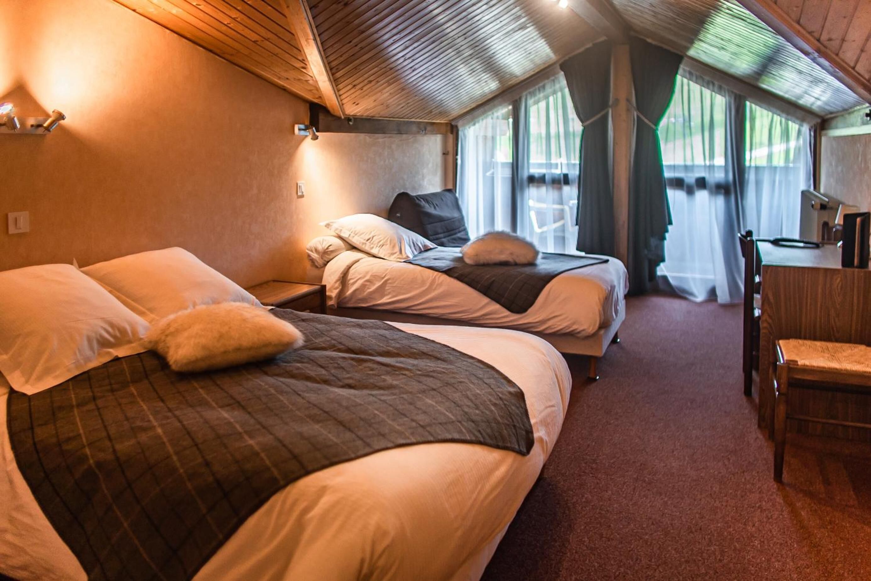 desk, blackout curtains, iron/ironing board, free cots/infant beds