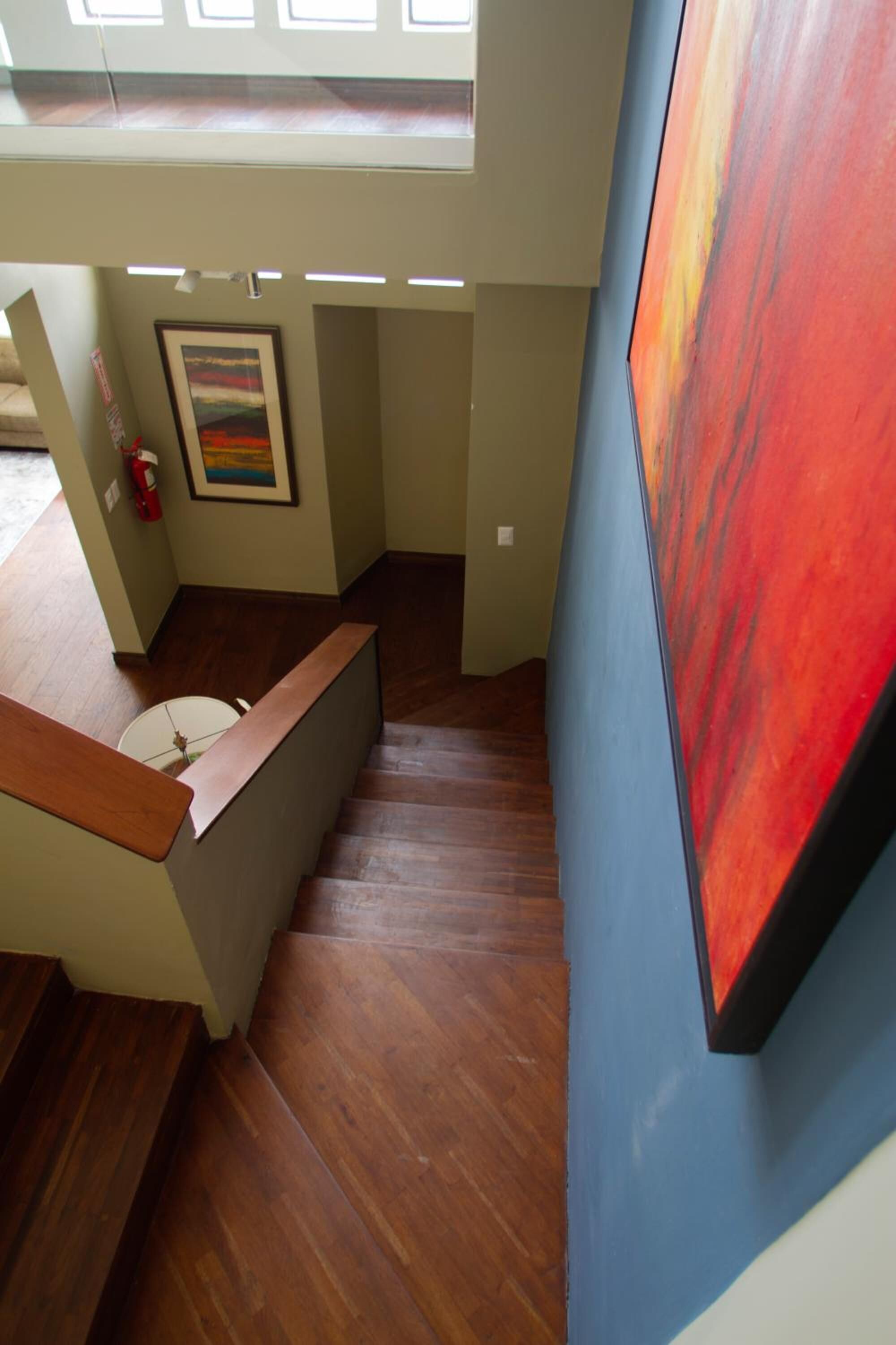 A staircase with wooden steps leading to a landing.