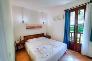 Camas con pillow-top, minibar y caja de seguridad en la habitación