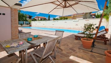 Outdoor pool, open 10:00 AM to 8:00 PM, pool umbrellas, sun loungers