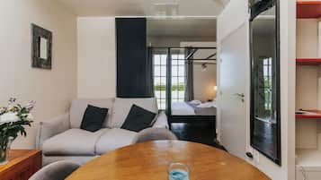 Standard Studio, Sea View, Garden Area | Living area | Flat-screen TV, DVD player