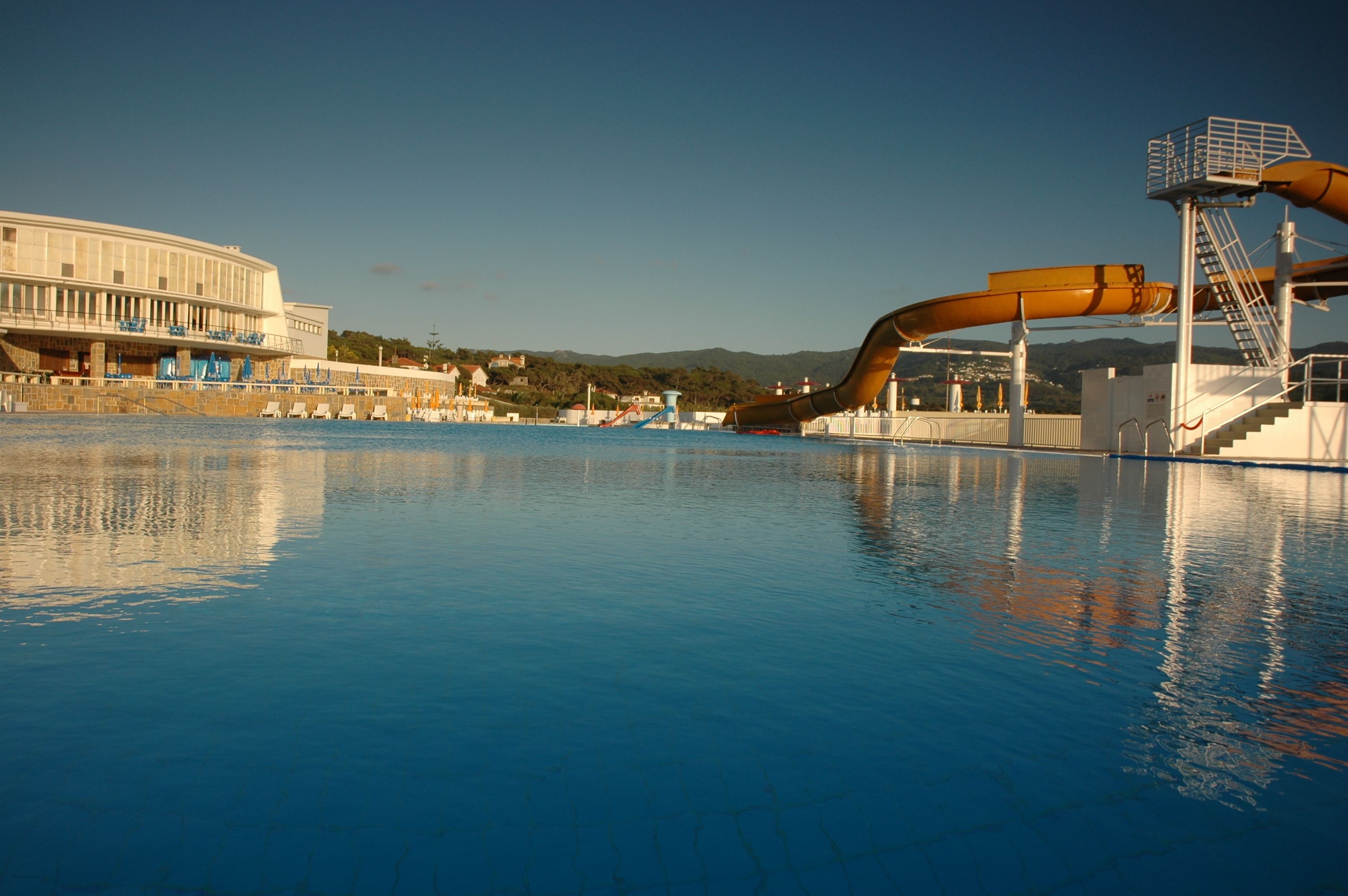 Seasonal outdoor pool, pool umbrellas, pool loungers