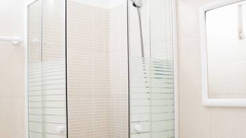 Family Studio, Patio, Garden Area | Bathroom | Shower, rainfall showerhead, free toiletries, hair dryer