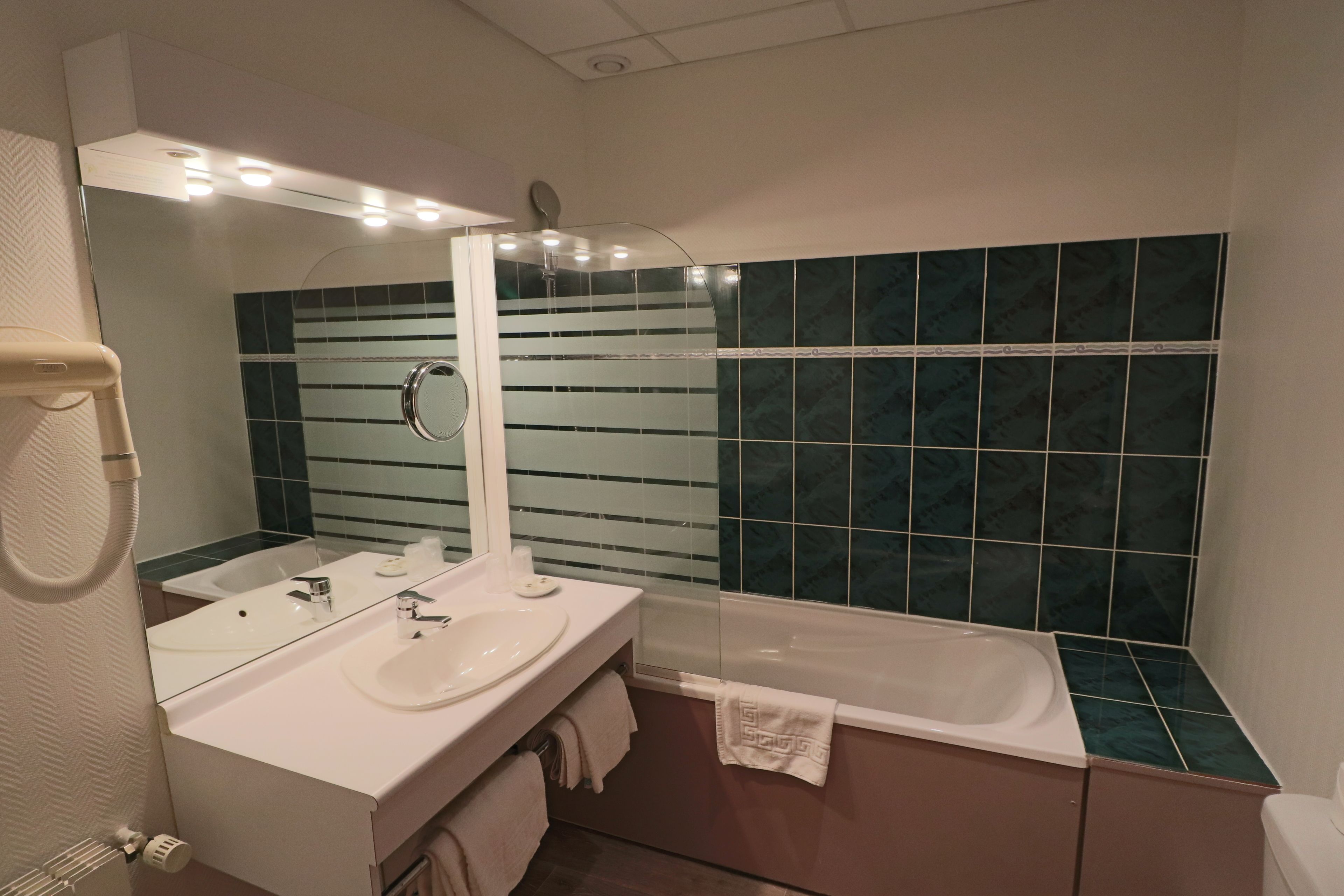 family room | bathroom | combined shower/bathtub, hair dryer, towels