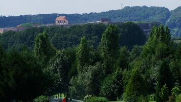 A golf course with a building in the background.