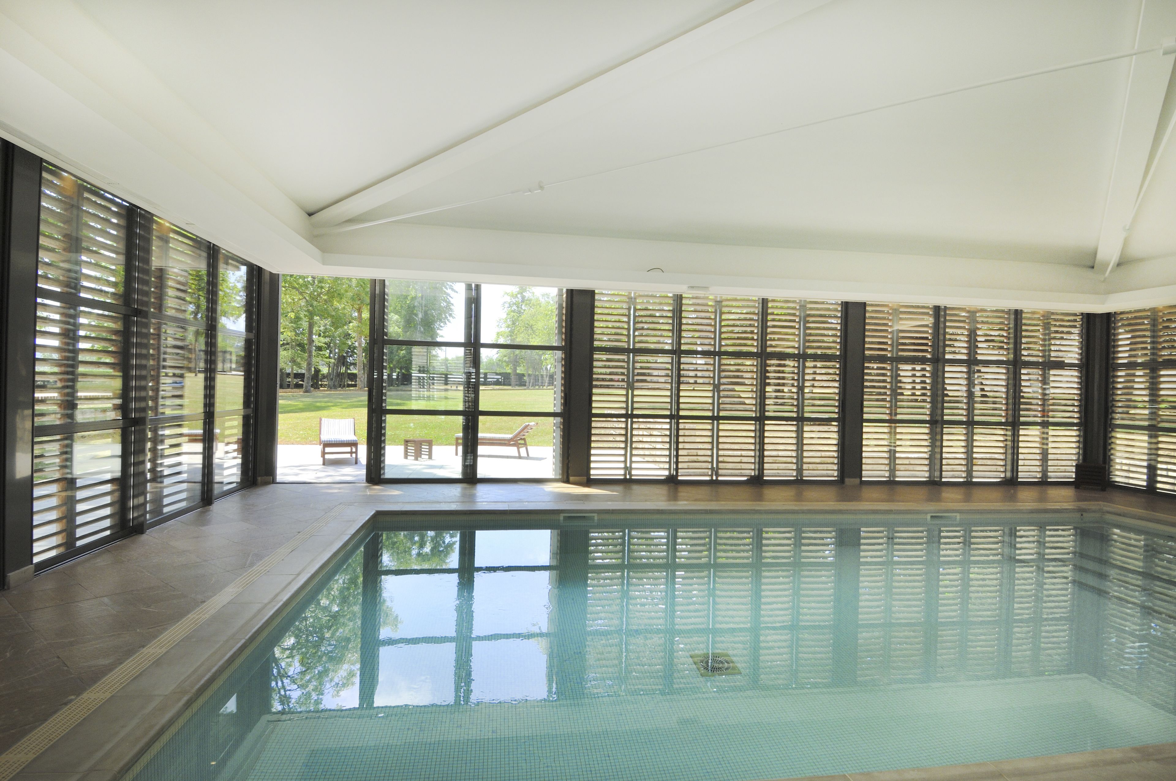 indoor pool, open 9:00 am to 8:00 pm, pool loungers