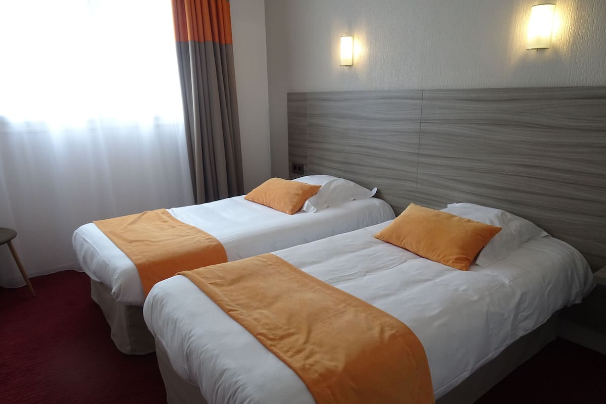 Comfort Twin Room | Premium bedding, desk, laptop workspace, soundproofing