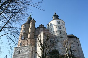 A historic castle with multiple towers and a large central building. - Brit Hotel Bristol Montbéliard (Montbeliard)