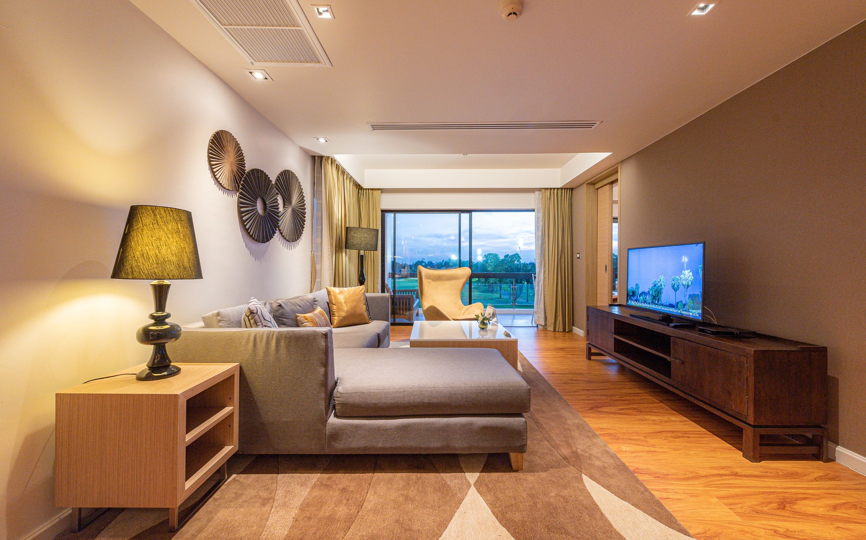 grand deluxe suite - free suvarnabhumi airport transfer | living area | 40-inch lcd tv with cable channels, tv