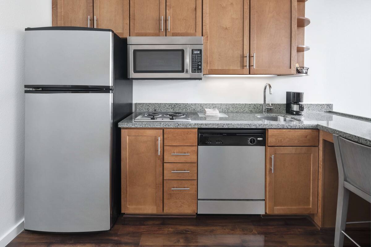 full-sized fridge, microwave, dishwasher, coffee/tea maker