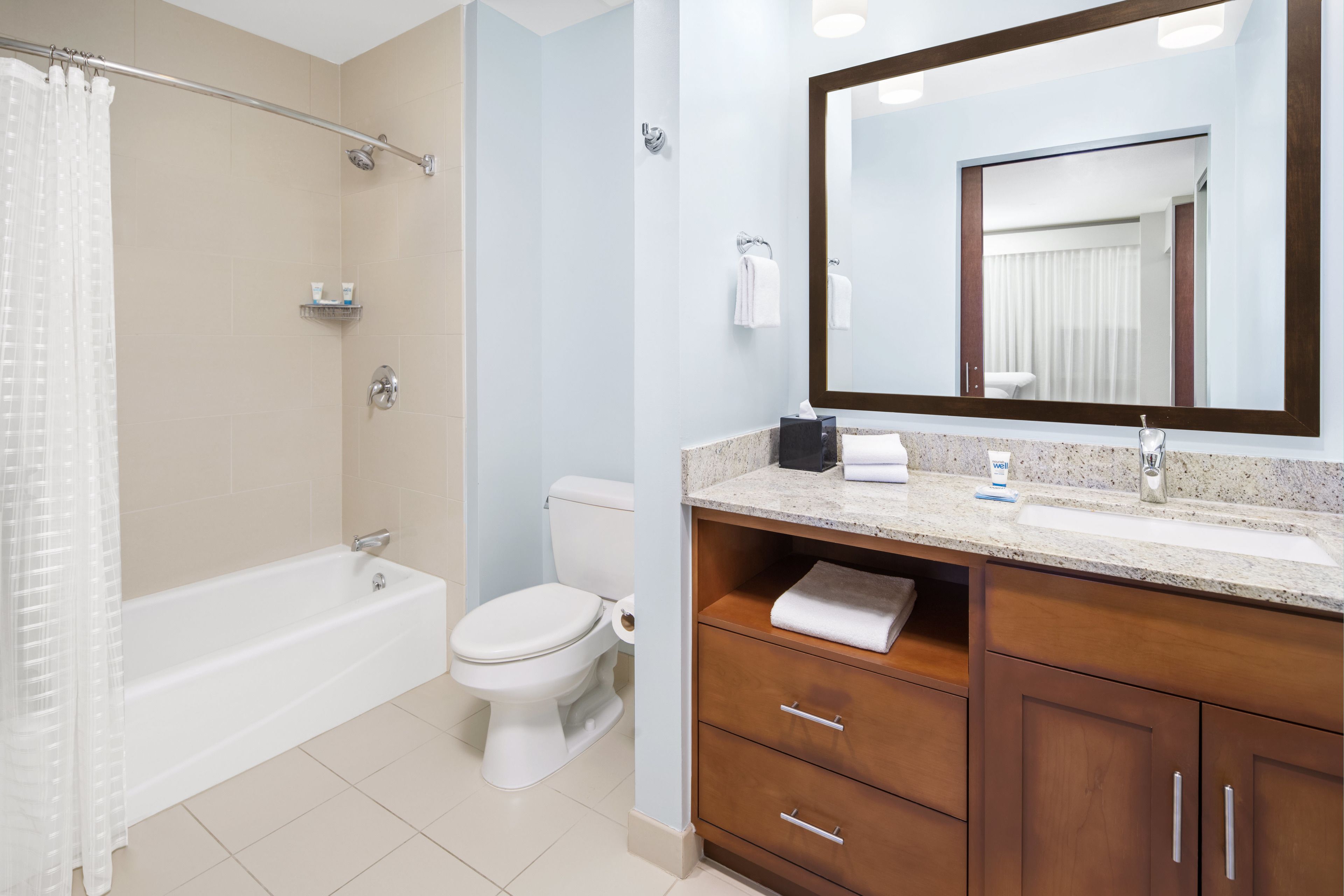 shower, designer toiletries, hair dryer, towels