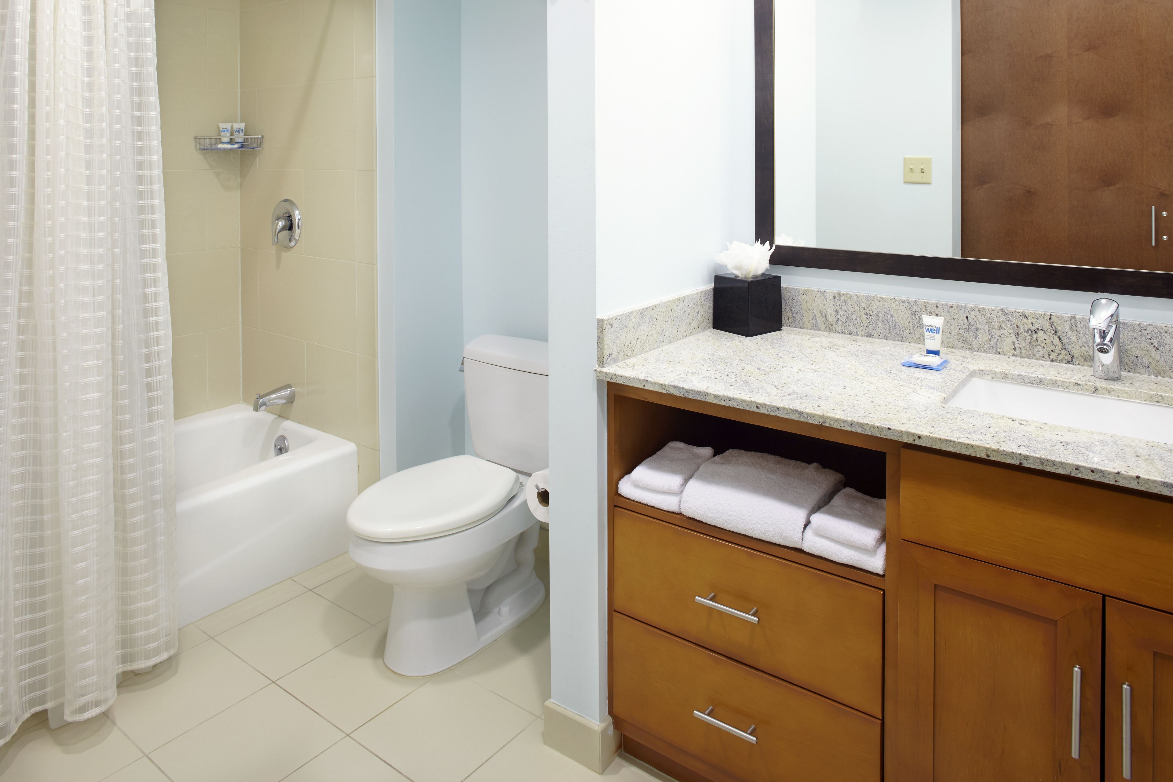 shower, designer toiletries, hair dryer, towels