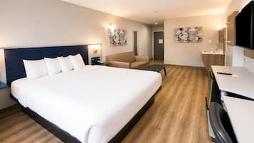 Suite, 1 très grand lit, non-fumeur | Bureau, système d’insonorisation, fer et planche à repasser