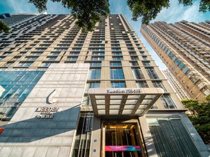 A LEEDEN HOTEL building with a modern facade, large windows, and a prominent entrance. - Leeden Hotel Guangzhou (Guangzhou)