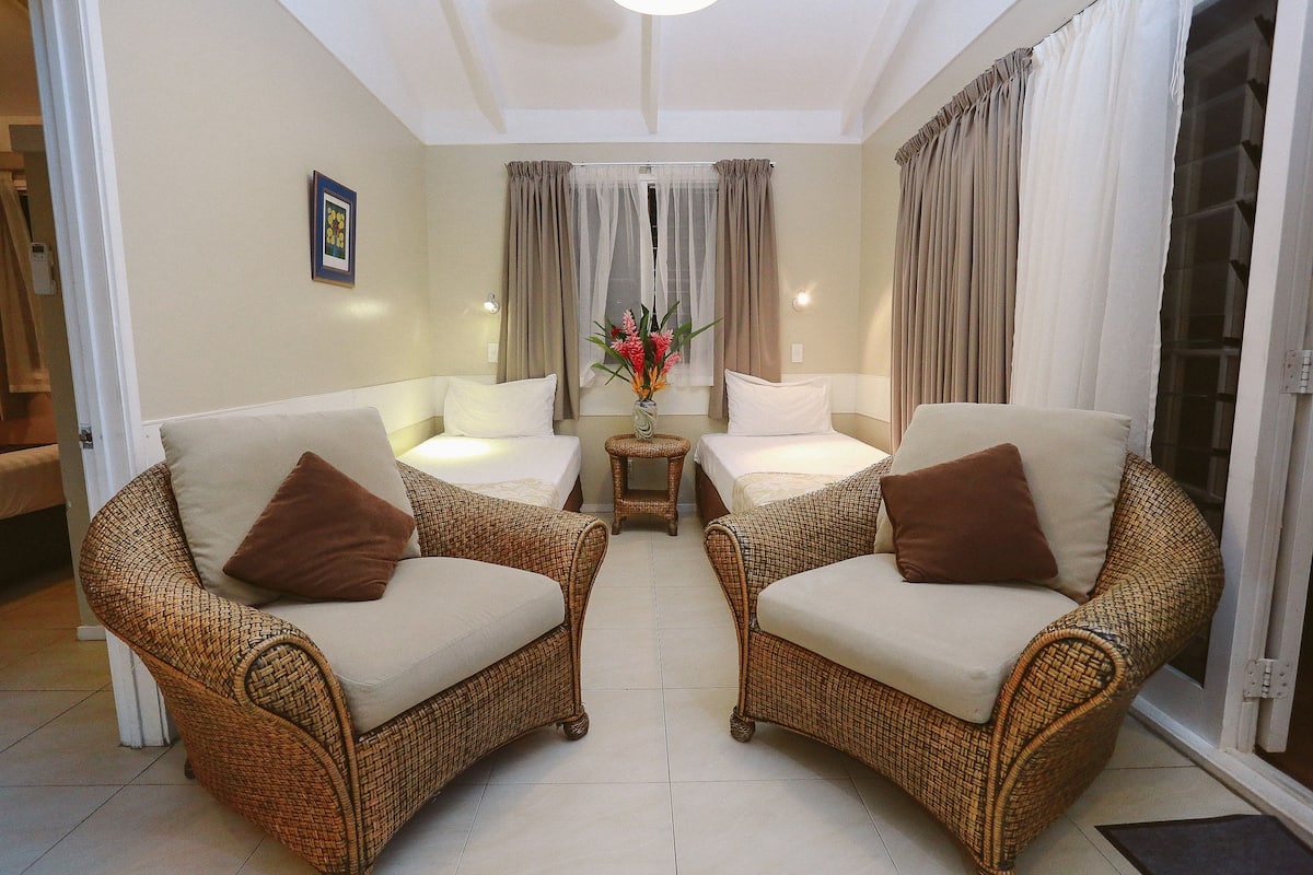 Standard Duplex, Garden Area | Living area | 32-cm flat-screen TV with digital channels, TV, iPod dock
