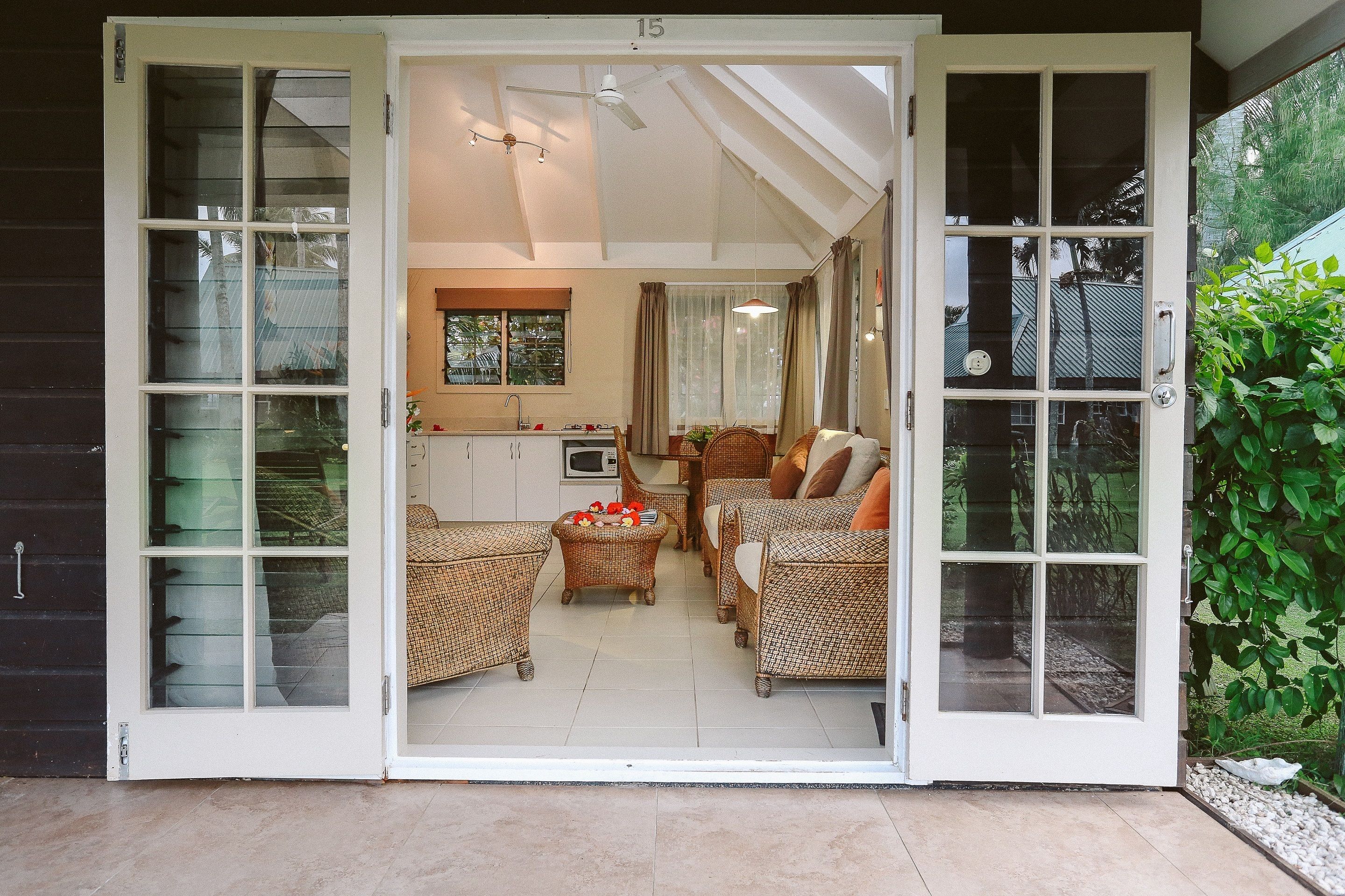 A modern interior with a kitchen, dining area, and seating.