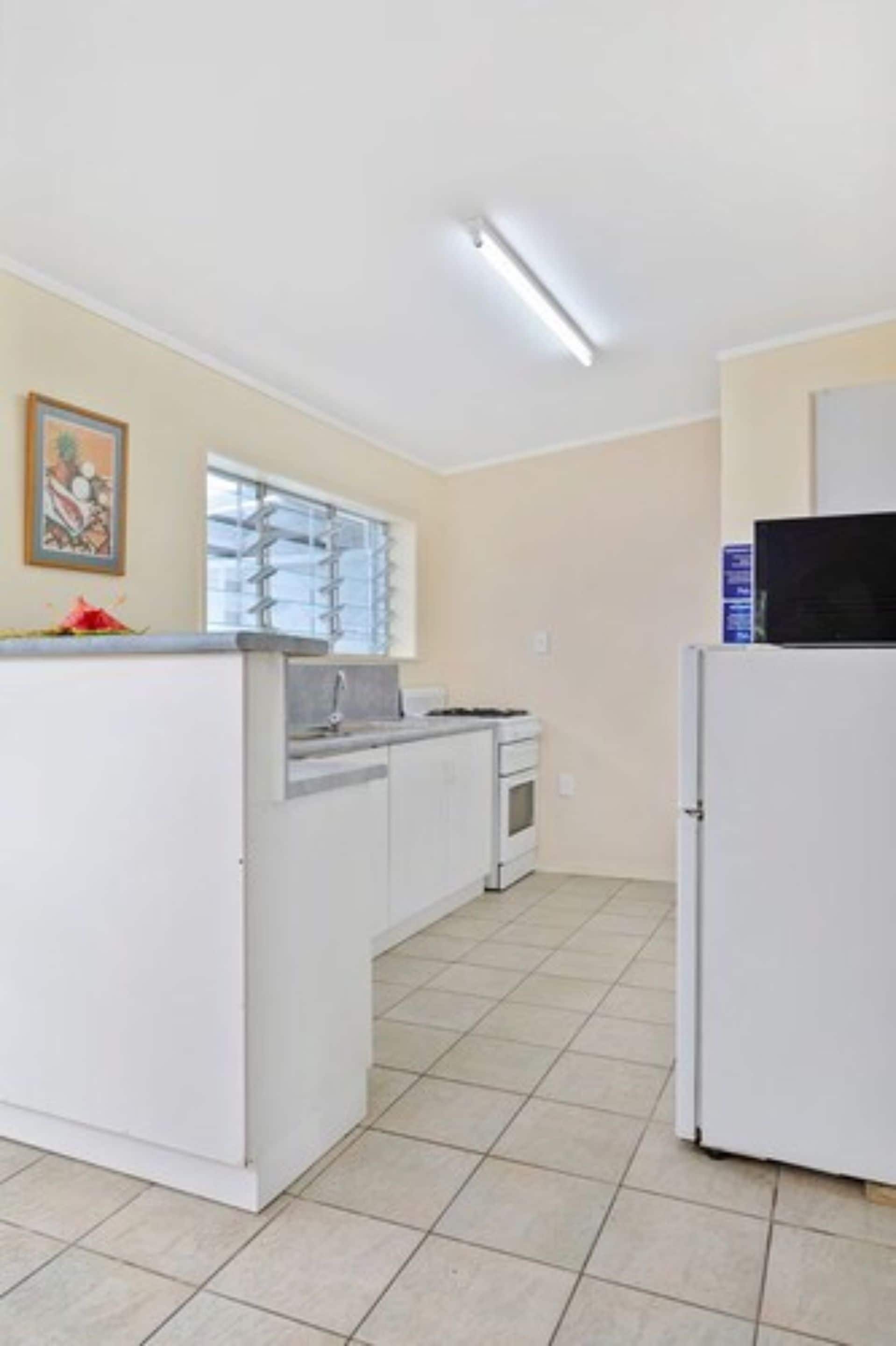 full-sized fridge, microwave, stovetop, coffee/tea maker