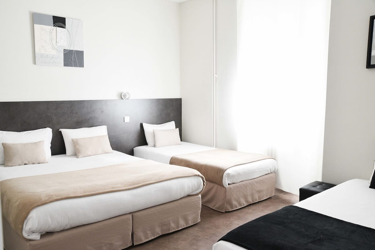 Quadruple Room | Down comforters, desk, free WiFi, bed sheets