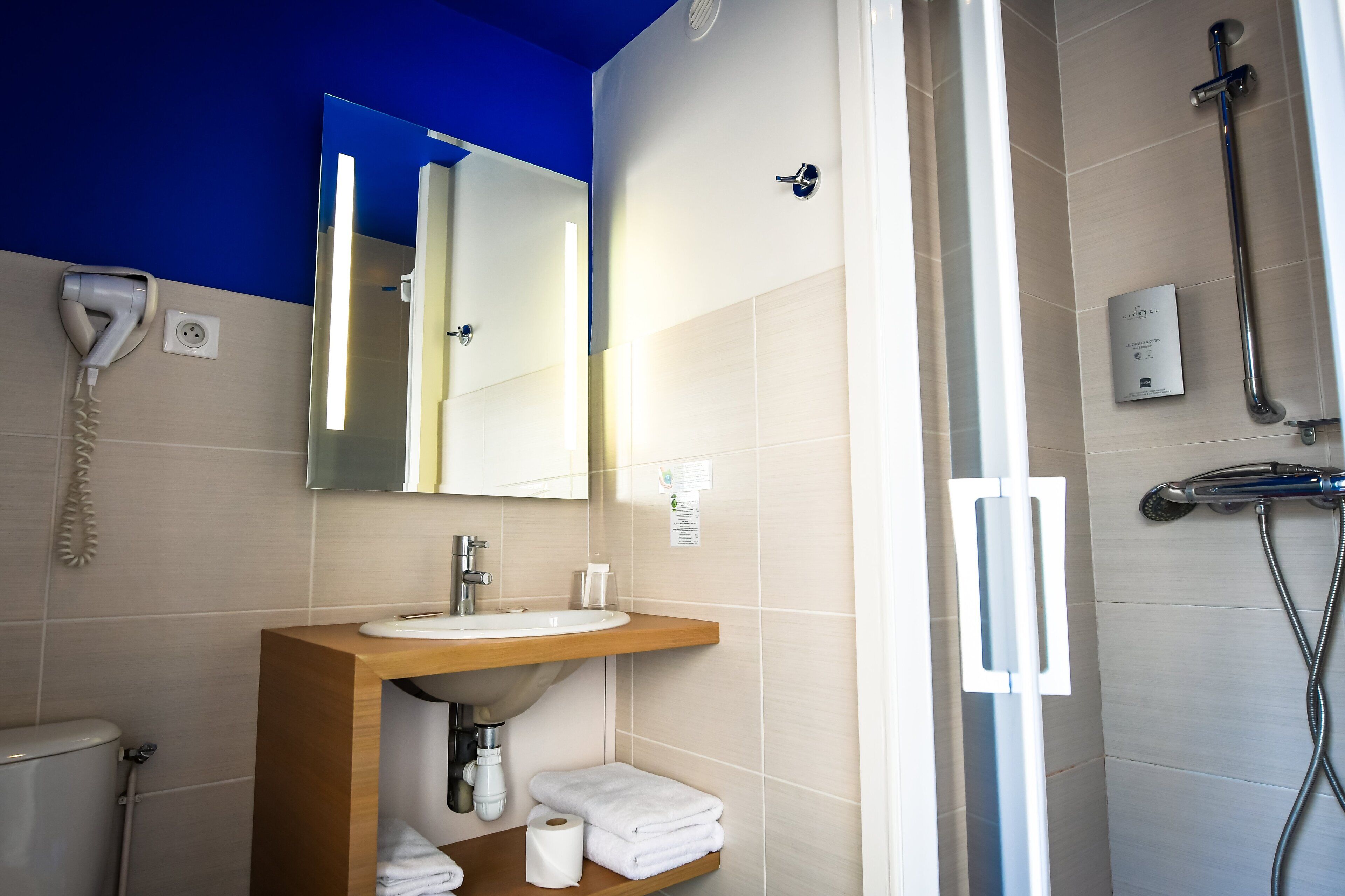 shower, free toiletries, hair dryer, towels