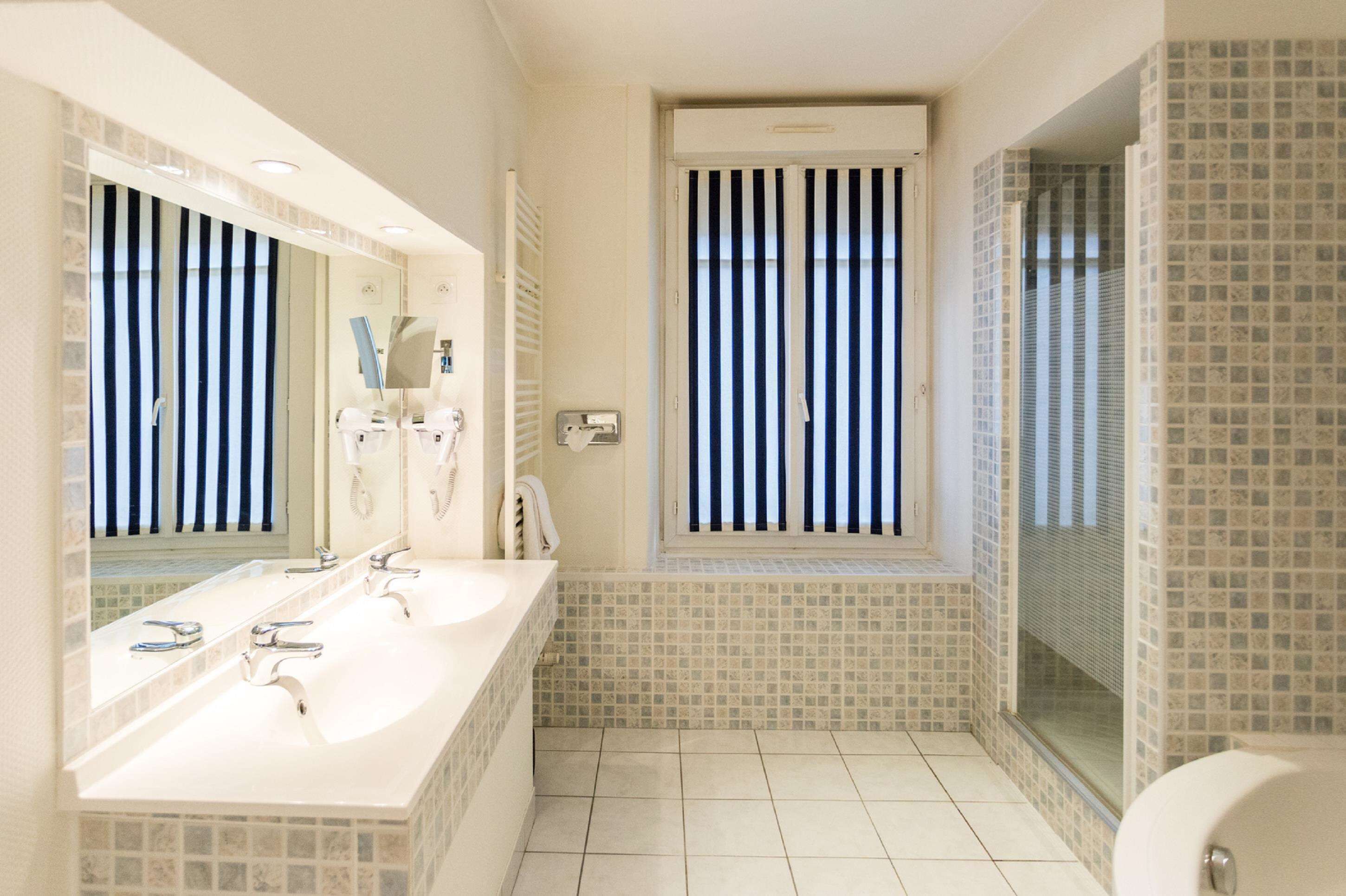 family room, 1 king bed, non smoking (with sofabed) | bathroom | free toiletries, hair dryer, towels, soap