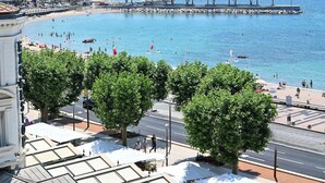 A coastal cityscape with a beach, promenade, and marina. - Excelsior (Saint-Raphael)