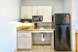Fridge, microwave, coffee/tea maker, dining tables