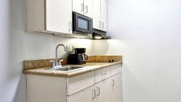 Fridge, microwave, coffee/tea maker, dining tables
