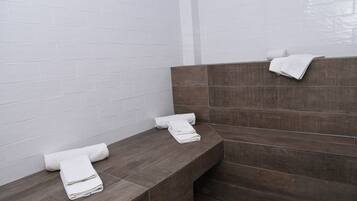 Relax in a calm and inviting space with benches and a clean design.