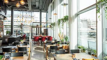 Enjoy meals in this stylish dining area with comfortable seating and city views.