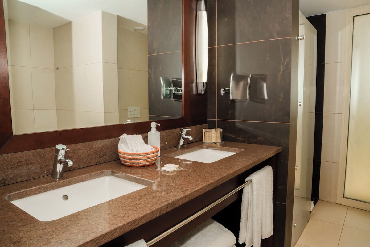 prestige room | bathroom | separate bathtub and shower, rainfall showerhead, free toiletries