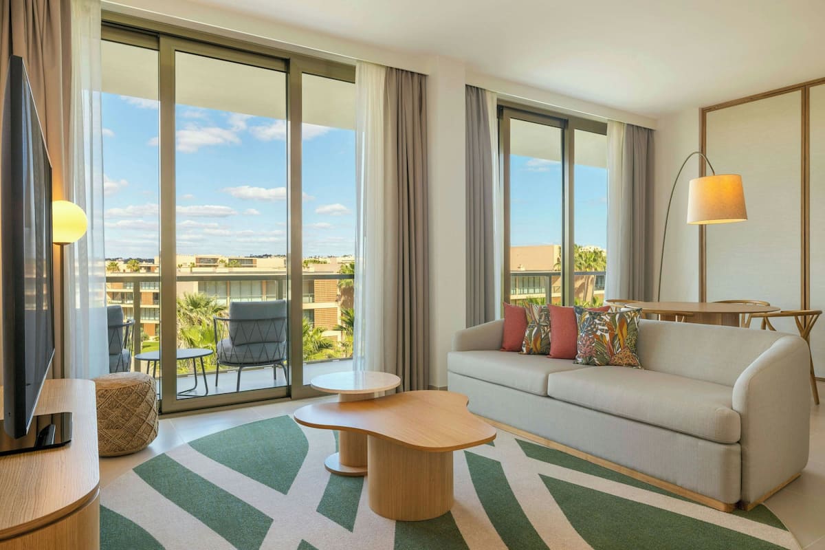 Junior Suite, 1 King Bed with Sofa bed, Balcony, Resort View | Living room | LCD TV, pay films