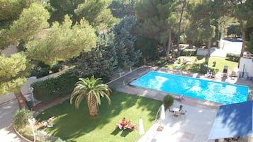 Seasonal outdoor pool, pool umbrellas, pool loungers