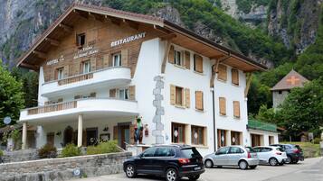 Experience the charm of the Alps at this traditional hotel, offering a balcony with breathtaking views of the surrounding landscape.
