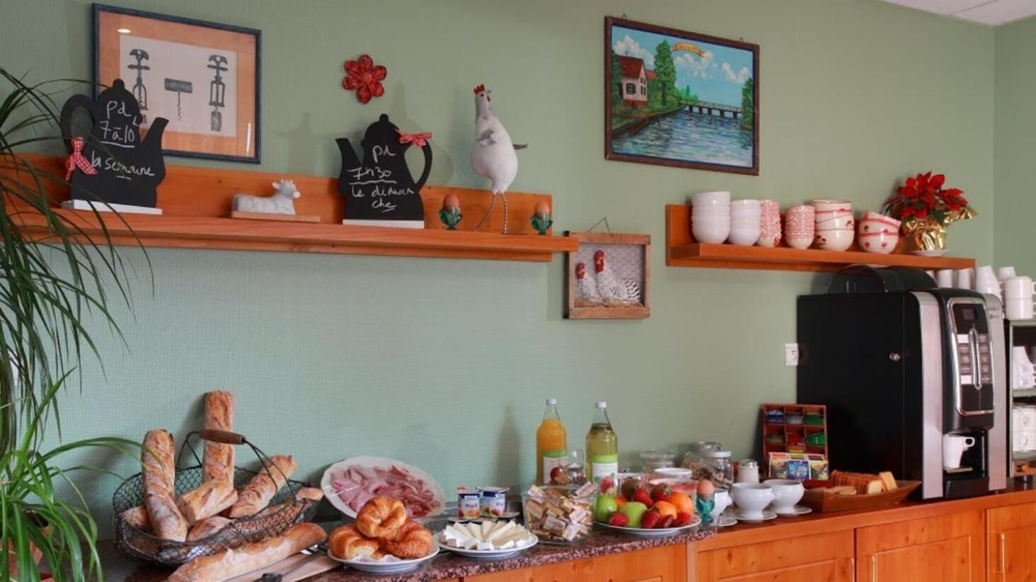 A breakfast buffet with various food items and a coffee machine.