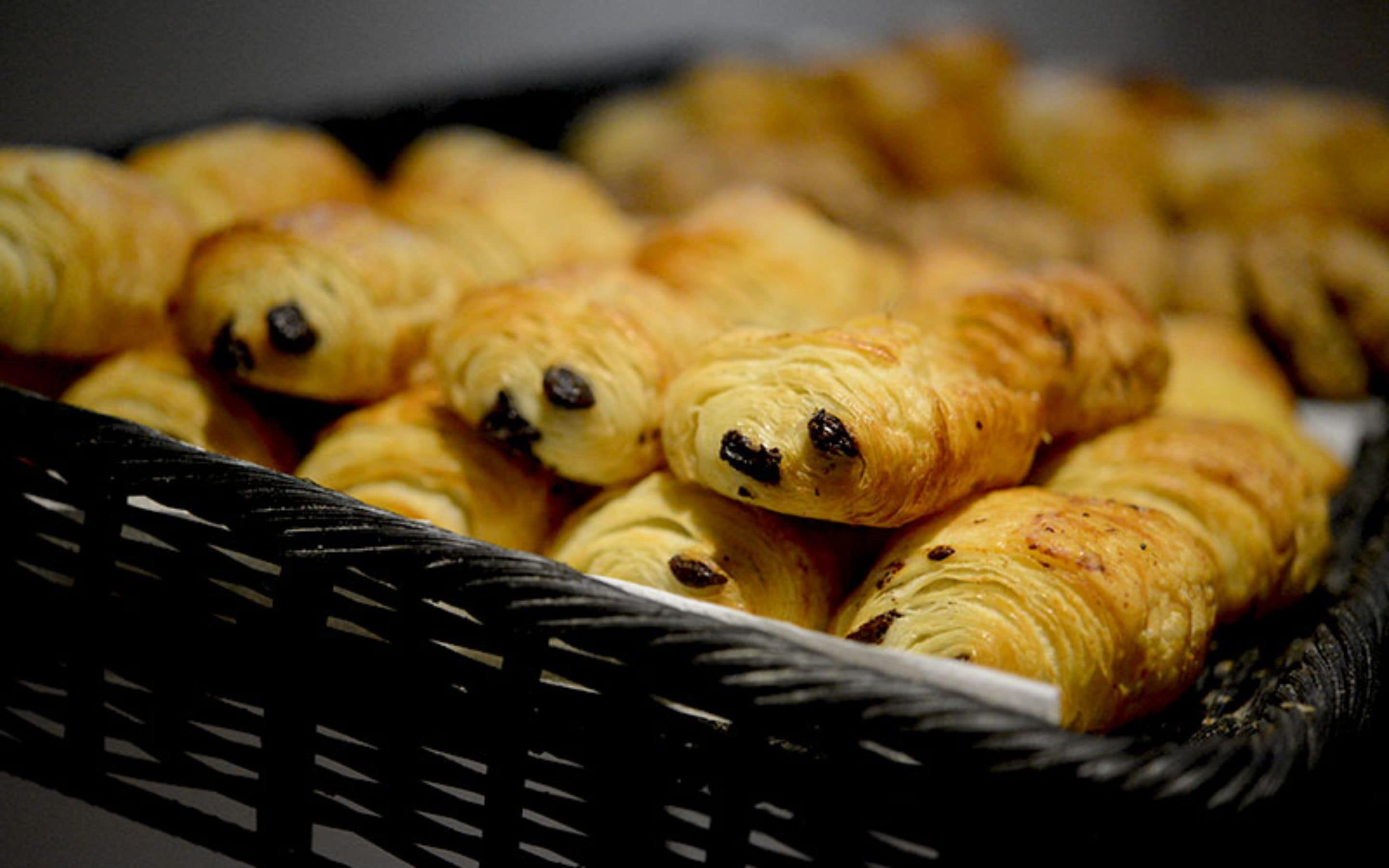 A basket filled with golden-brown pastries.