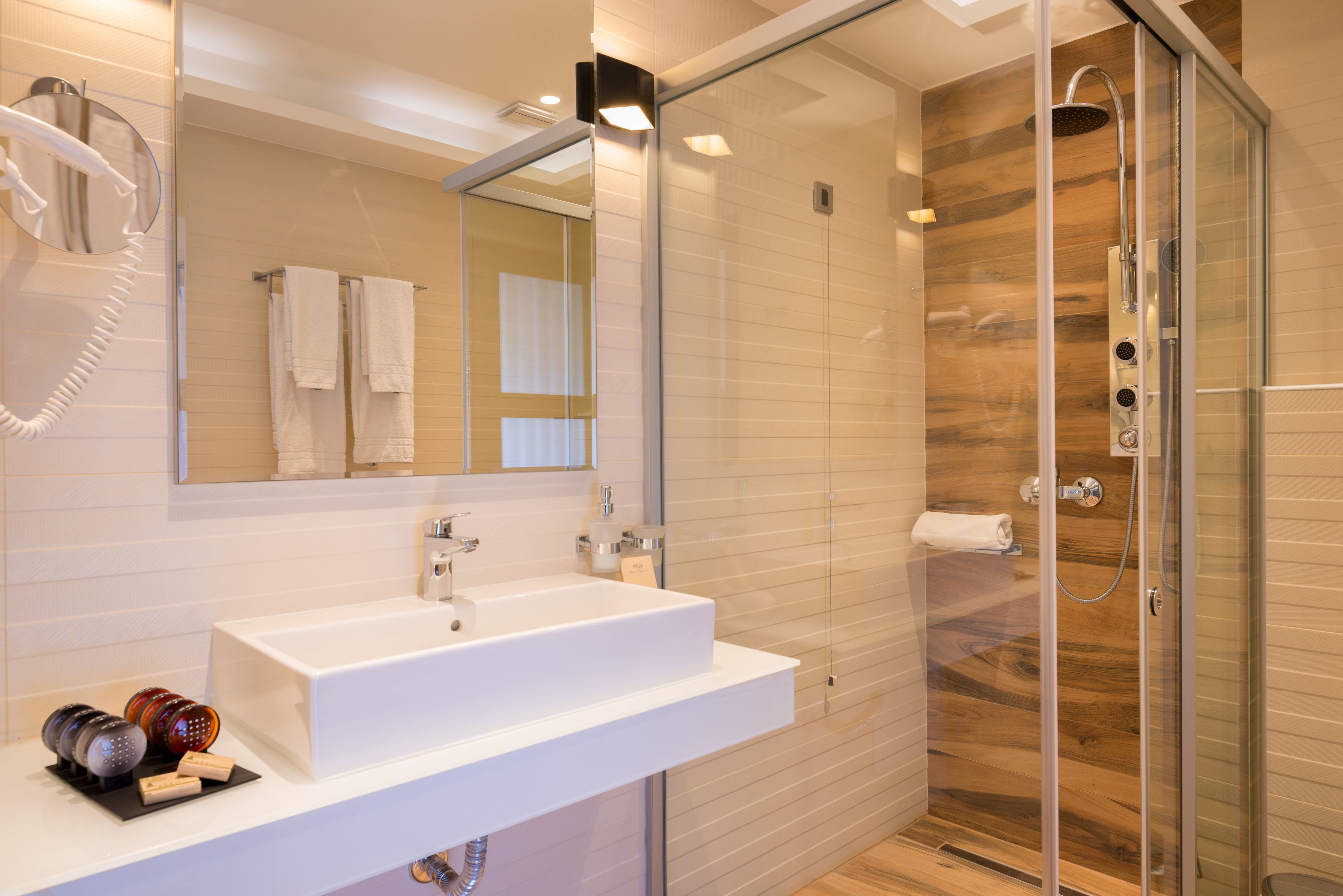 designer toiletries, hair dryer, bathrobes, slippers