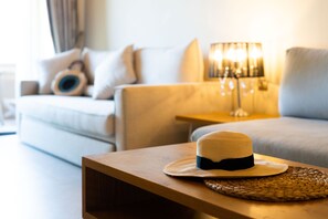 Executive Suite, Partial Sea View | Living area | 43-inch plasma TV with satellite channels, TV, DVD player