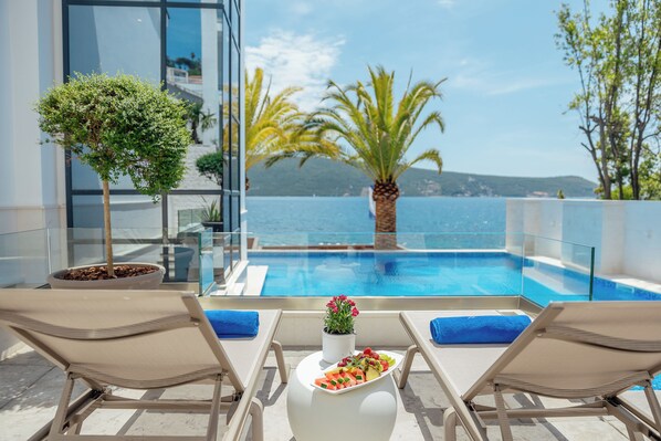 Seasonal outdoor pool, pool loungers