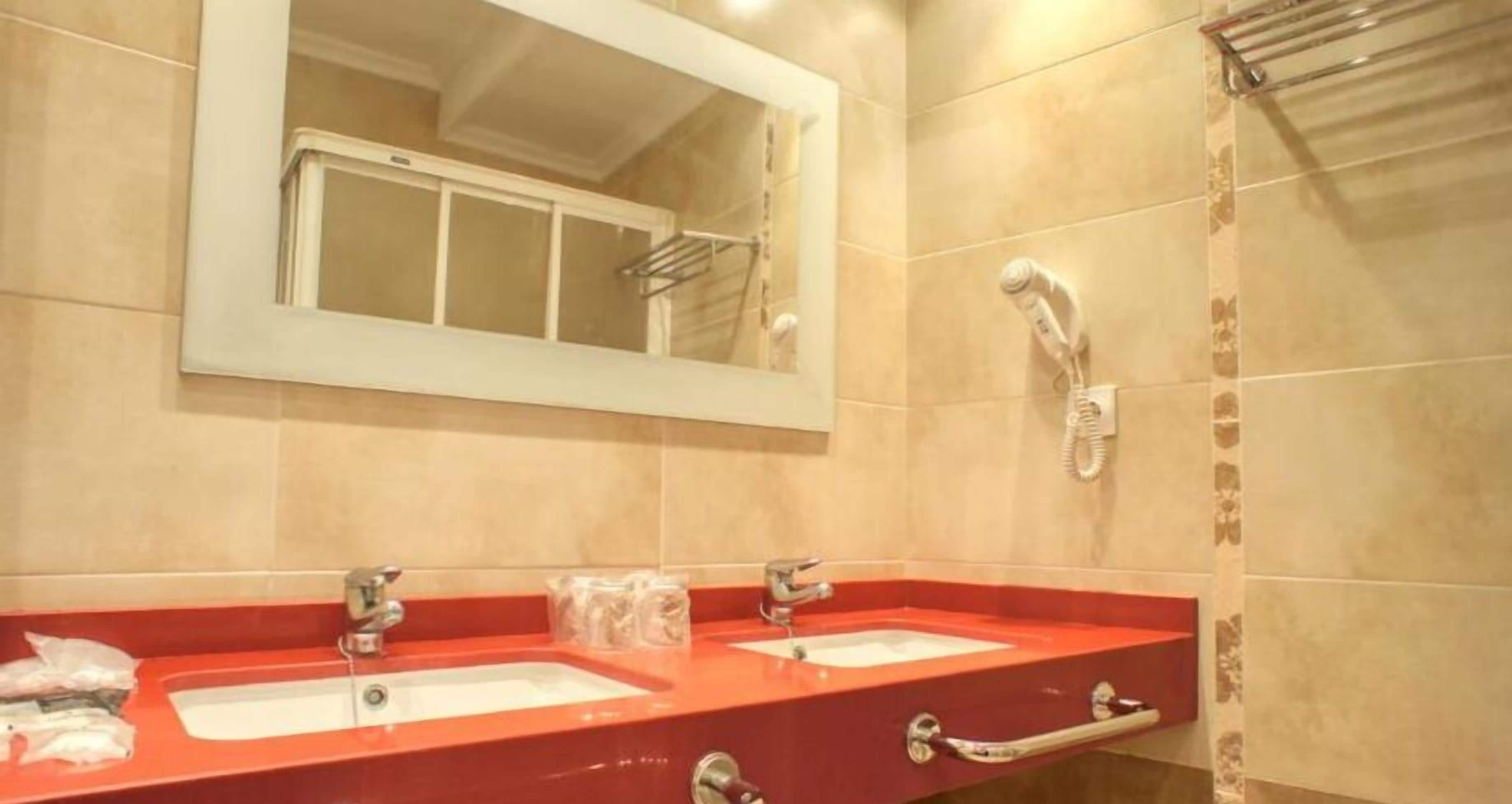 deep-soaking bathtub, hair dryer, bidet, towels